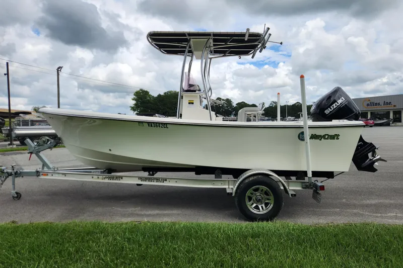 Slide: The Image of 2023 May-Craft 1900CC boat on trailer with Suzuki outboard motor, parked outdoors. - 5