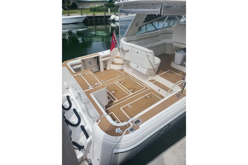 Slide: The Image of 2010 Intrepid 475 Sport Yacht with spacious deck and seating area. - 3