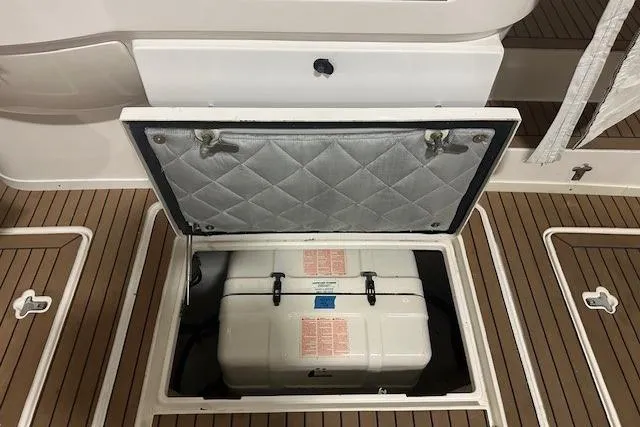 Slide: The Image of Open hatch on 2010 Intrepid 475 Sport Yacht revealing storage compartment. - 9
