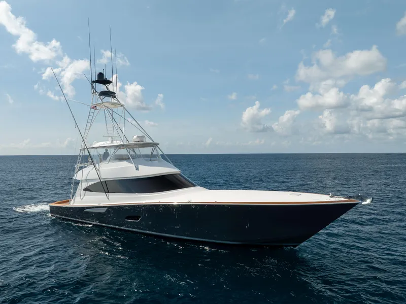 The Image of 2020 Viking 80 Convertible yacht cruising on open sea under clear skies. - 0