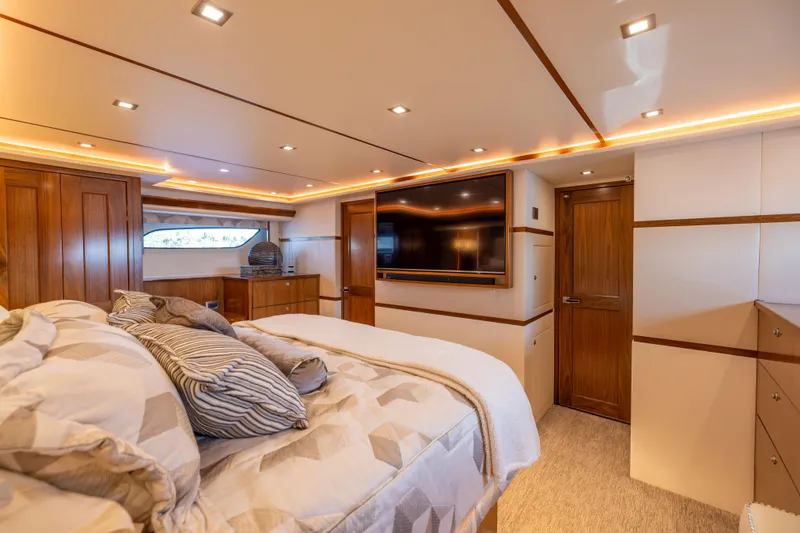 Slide: The Image of Luxurious bedroom interior of 2020 Viking 80 Convertible yacht with modern amenities. - 22
