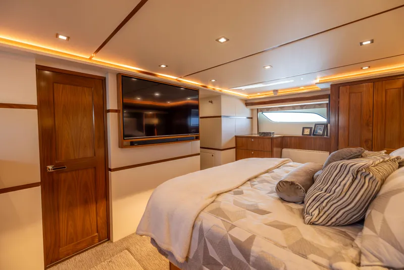 Slide: The Image of Luxurious bedroom interior of 2020 Viking 80 Convertible yacht with modern amenities. - 23