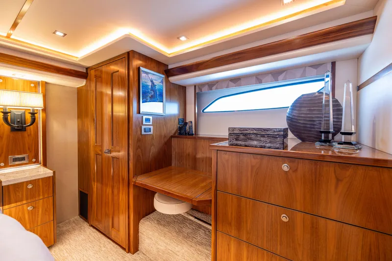 Slide: The Image of Luxurious interior of 2020 Viking 80 Convertible yacht with elegant wood finishes. - 25