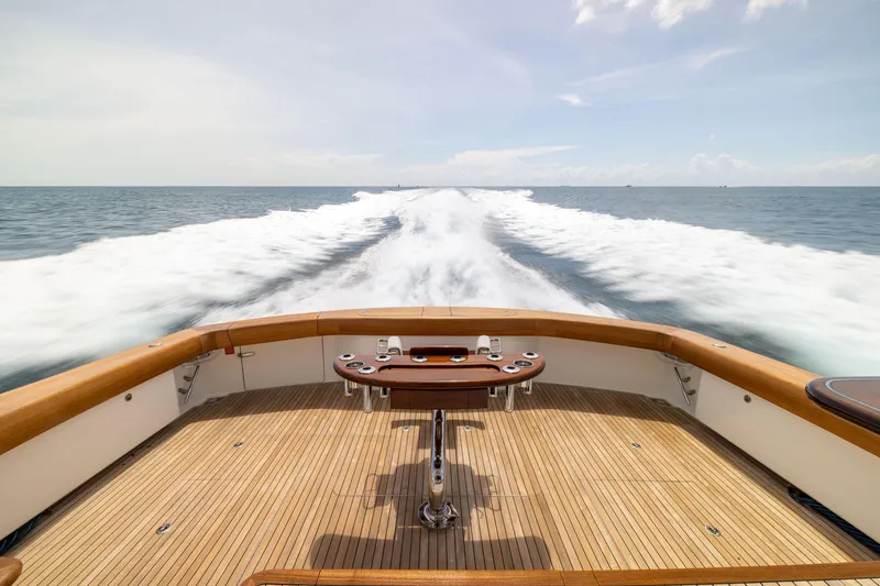 Slide: The Image of 2020 Viking 80 Convertible yacht cruising on open sea, view from deck. - 40