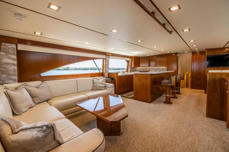 Slide: The Image of Luxurious interior of 2020 Viking 80 Convertible yacht with elegant seating and wooden finishes. - 5