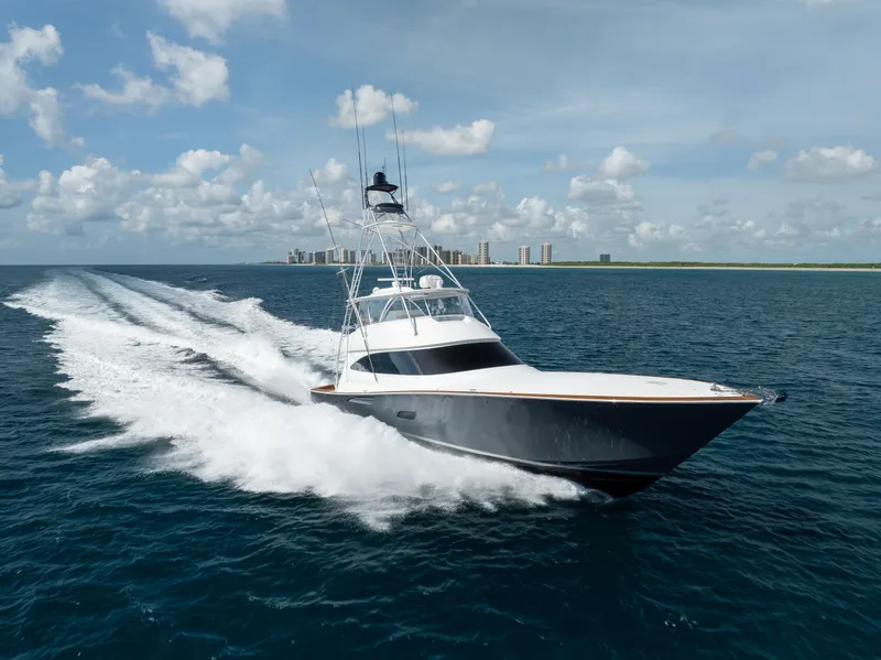 Slide: The Image of 2020 Viking 80 Convertible yacht cruising on open sea under blue sky. - 93