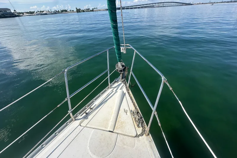 Slide: The Image of Bow view of 2003 Beneteau Oceanis Clipper 331 sailboat on calm water. - 21