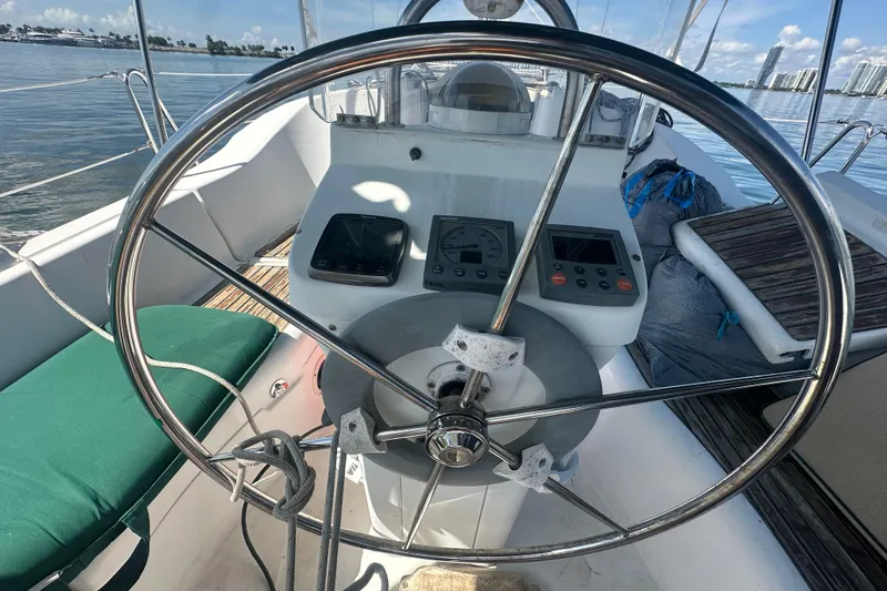 Slide: The Image of Steering wheel of 2003 Beneteau Oceanis Clipper 331 sailboat with navigation instruments. - 23