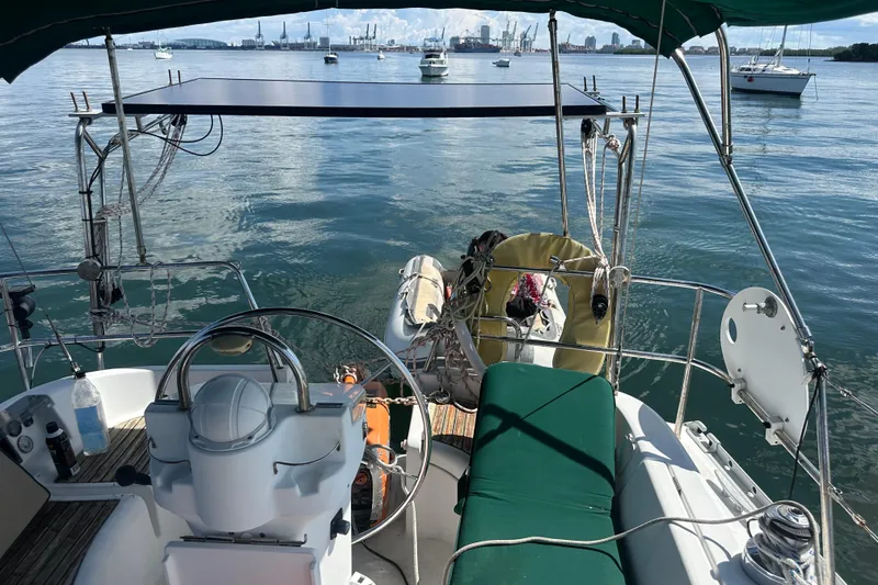 Slide: The Image of Cockpit view of 2003 Beneteau Oceanis Clipper 331 sailboat on calm water. - 27