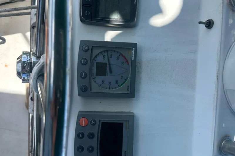 Slide: The Image of Beneteau Oceanis Clipper 331 cockpit instruments, 2003 model, featuring navigation and wind gauges. - 33