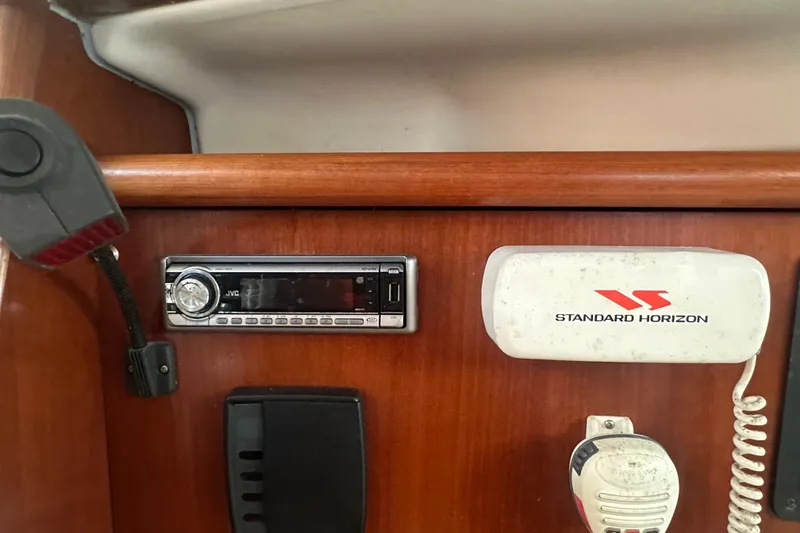 Slide: The Image of Interior of 2003 Beneteau Oceanis Clipper 331 with JVC stereo and Standard Horizon radio. - 40