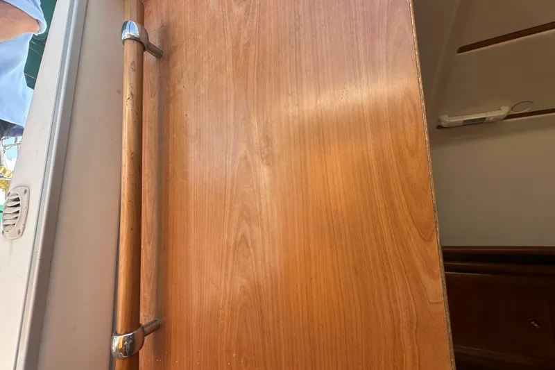 Slide: The Image of Wooden interior door of a 2003 Beneteau Oceanis Clipper 331 sailboat. - 42