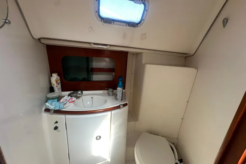Slide: The Image of Bathroom interior of 2003 Beneteau Oceanis Clipper 331 yacht, featuring sink and toilet. - 61