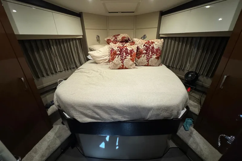 Slide: The Image of Luxurious bedroom interior of 2017 Carver C40 Command Bridge yacht with elegant bedding. - 10