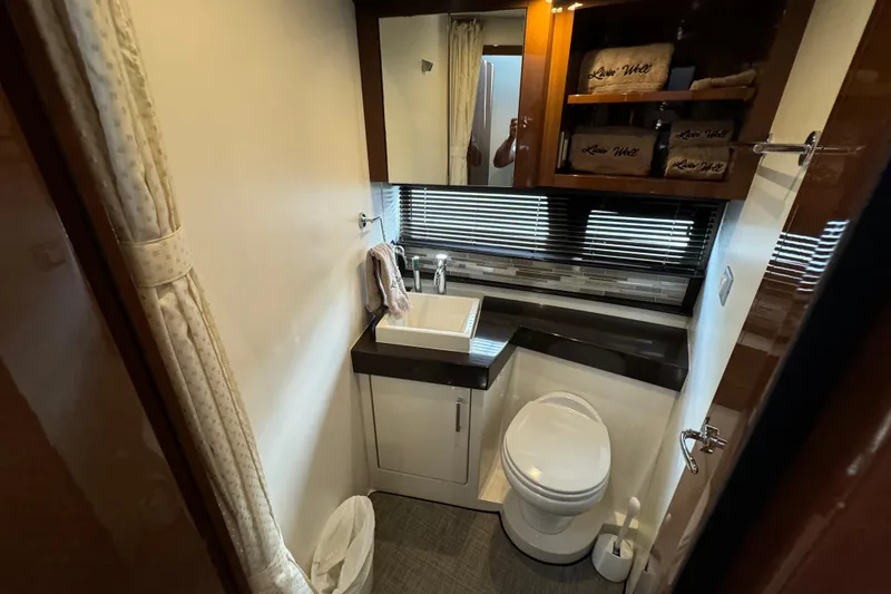 Slide: The Image of 2017 Carver C40 Command Bridge yacht bathroom with modern fixtures and elegant design. - 12