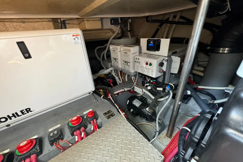 Slide: The Image of Engine room of 2017 Carver C40 Command Bridge with Kohler generator and electrical components. - 26