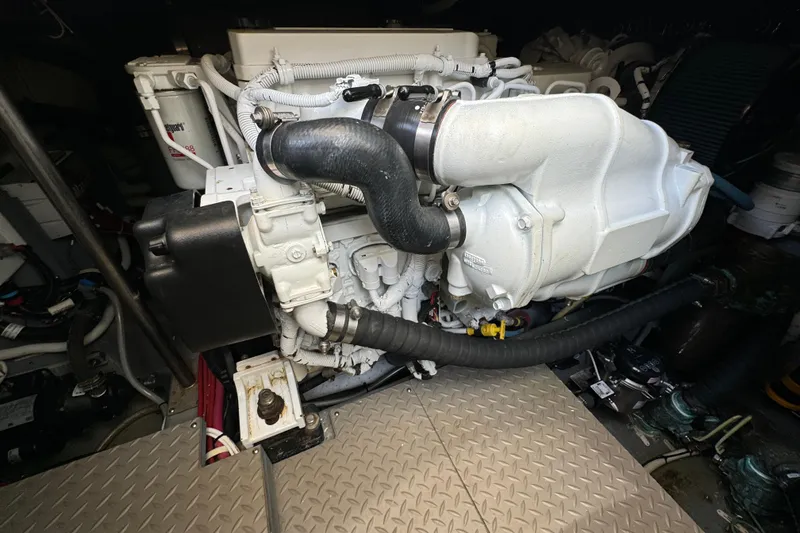 Slide: The Image of Engine room of a 2017 Carver C40 Command Bridge, showcasing mechanical components. - 28