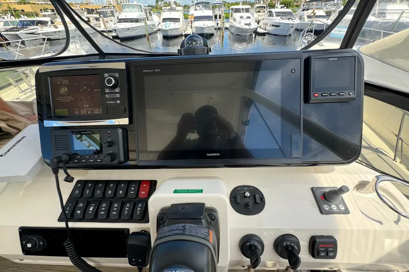 Slide: The Image of 2017 Carver C40 Command Bridge helm with Garmin navigation system, docked at marina. - 9