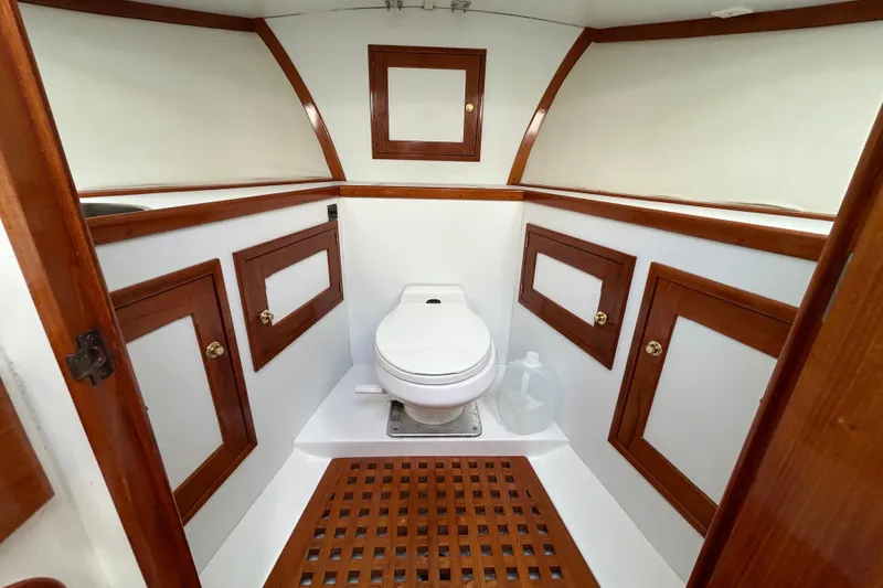 Slide: The Image of Luxurious 1995 Holland Pettegrow Cruiser bathroom with wooden accents and modern fixtures. - 13