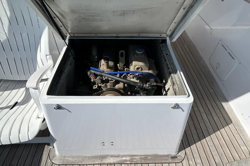 Slide: The Image of Engine compartment of a 1995 Holland Pettegrow Cruiser, showcasing mechanical components. - 17