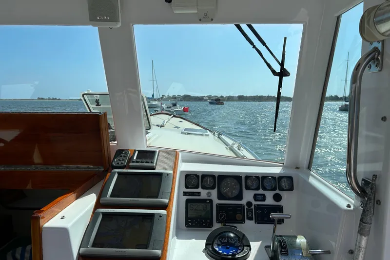 Slide: The Image of Interior view of 1995 Holland Pettegrow Cruiser cockpit with navigational instruments. - 27
