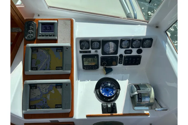 Slide: The Image of 1995 Holland Pettegrow Cruiser dashboard with navigation instruments and controls. - 7