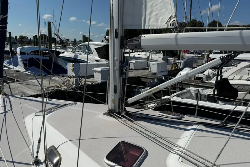 Slide: The Image of Catalina 310 sailboat from 2008 docked at a marina with other boats. - 3