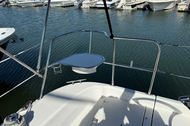 Slide: The Image of 2008 Catalina 310 sailboat deck with stainless steel railings at marina. - 7