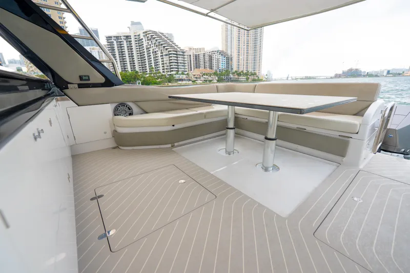 Slide: The Image of Luxurious 2021 Azimut Verve 47 yacht interior with elegant seating and table, cityscape view. - 10