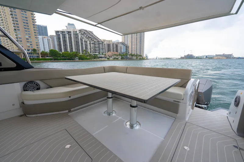 Slide: The Image of Luxury seating area on 2021 Azimut Verve 47 yacht with cityscape view. - 11