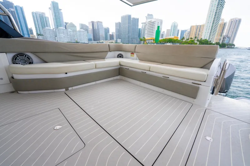 Slide: The Image of 2021 Azimut Verve 47 yacht deck with city skyline in the background. - 12