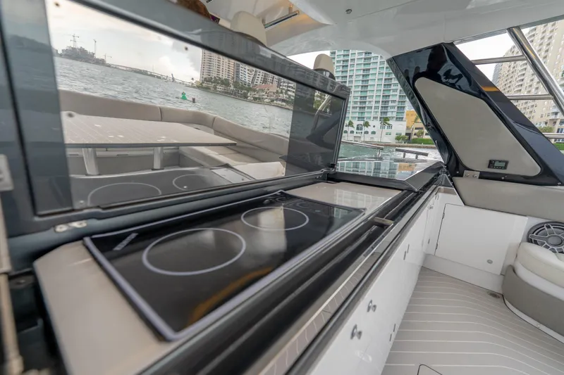 Slide: The Image of Luxury Azimut Verve 47 yacht interior with modern kitchen, 2021 model, docked by waterfront. - 13