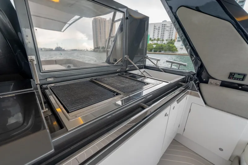 Slide: The Image of Outdoor kitchen on 2021 Azimut Verve 47 yacht with grill and scenic water view. - 14