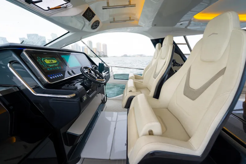 Slide: The Image of Interior of 2021 Azimut Verve 47 yacht with modern dashboard and luxurious seating. - 16