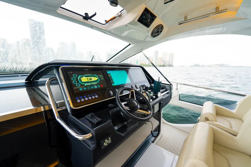 Slide: The Image of 2021 Azimut Verve 47 yacht helm with modern navigation system and luxurious seating. - 18