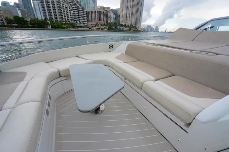Slide: The Image of Luxurious seating area on a 2021 Azimut Verve 47 yacht, with cityscape background. - 24