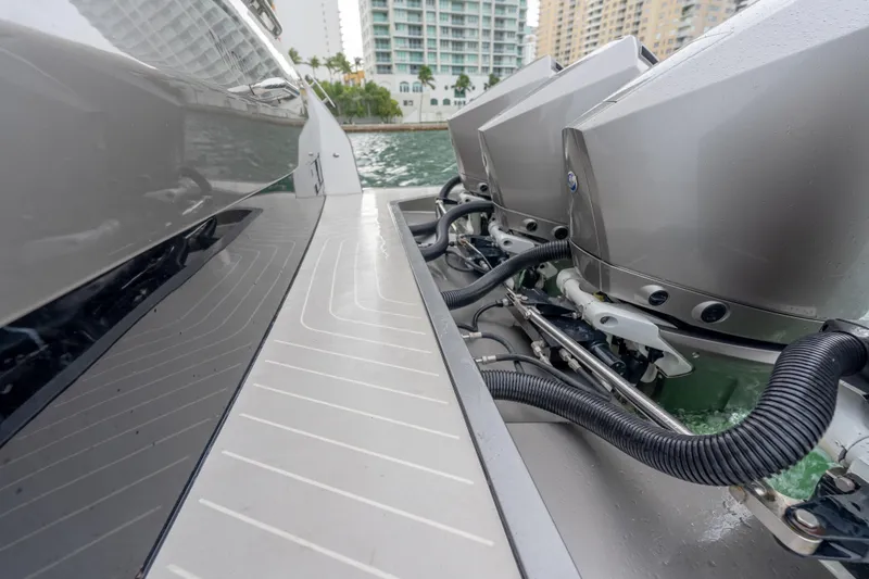 Slide: The Image of 2021 Azimut Verve 47 boat engines and deck, docked near waterfront buildings. - 28