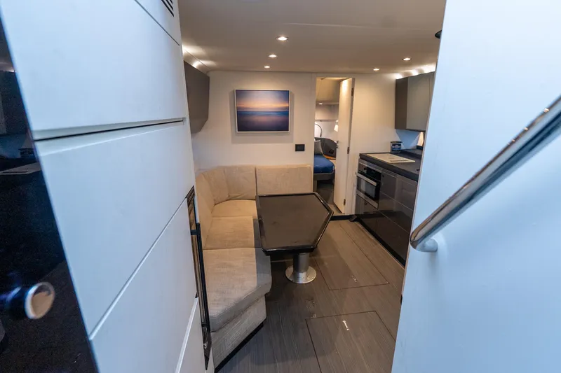 Slide: The Image of Interior of 2021 Azimut Verve 47 yacht with modern kitchen and cozy seating area. - 29