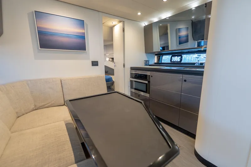 Slide: The Image of Interior of 2021 Azimut Verve 47 yacht with modern kitchen and seating area. - 30