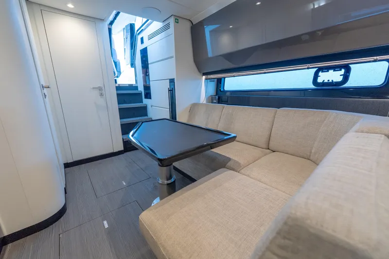 Slide: The Image of Luxurious interior of 2021 Azimut Verve 47 yacht with modern seating and table. - 32