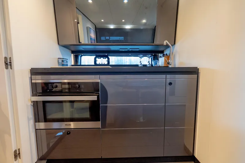 Slide: The Image of Modern kitchen interior of 2021 Azimut Verve 47 yacht with sleek cabinetry and appliances. - 35