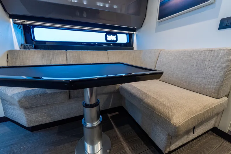 Slide: The Image of Interior of 2021 Azimut Verve 47 yacht with beige seating and sleek black table. - 36
