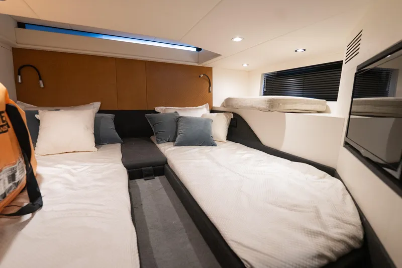 Slide: The Image of Interior cabin of 2021 Azimut Verve 47 yacht with twin beds and modern decor. - 37