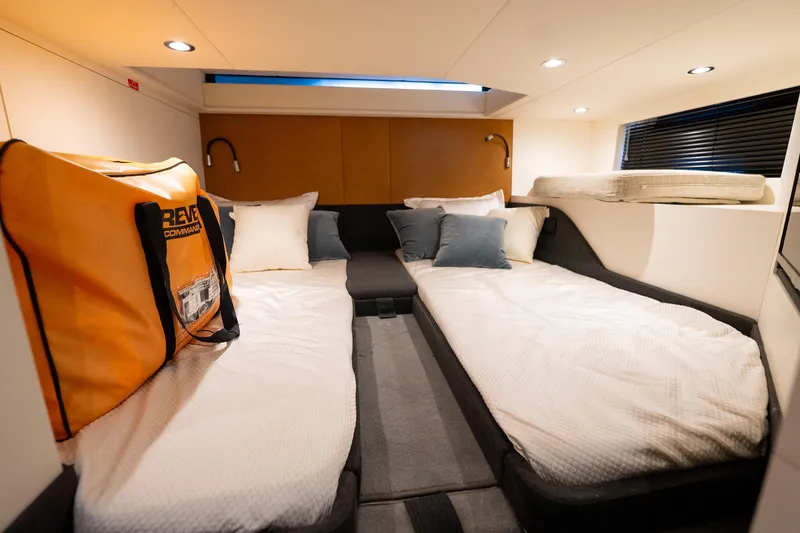 Slide: The Image of Luxurious cabin interior of 2021 Azimut Verve 47 yacht with twin beds and modern decor. - 38