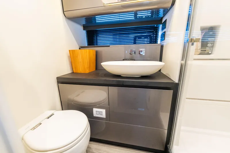 Slide: The Image of Modern bathroom interior on 2021 Azimut Verve 47 yacht, featuring sleek sink and toilet. - 39