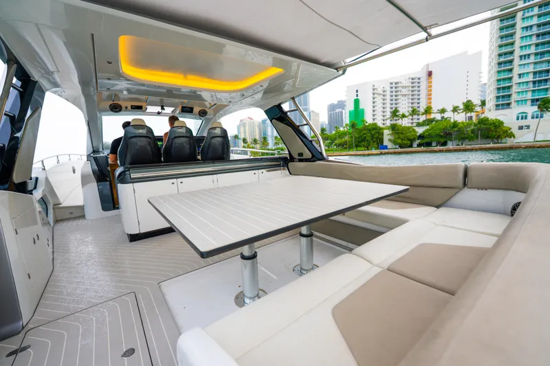 Slide: The Image of Interior of 2021 Azimut Verve 47 yacht with seating and table, cityscape view. - 6