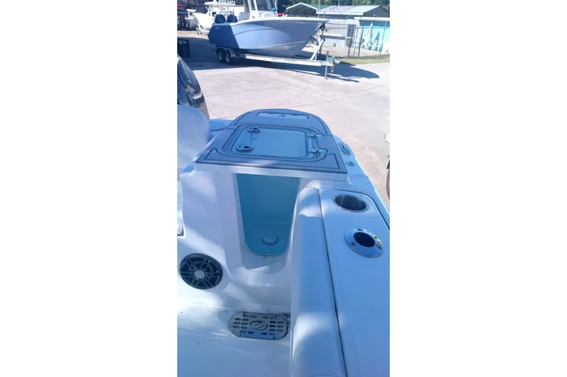 Slide: The Image of 2025 Seafox 228 Commander boat interior with storage compartments and cup holders. - 8