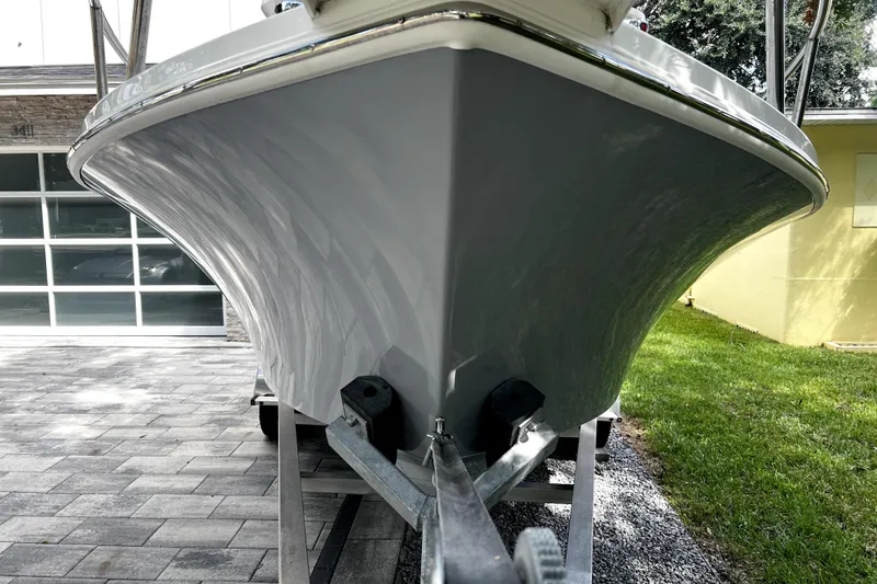 Slide: The Image of 2023 Parker 2120 Sport Cabin boat on trailer, close-up view of hull. - 15