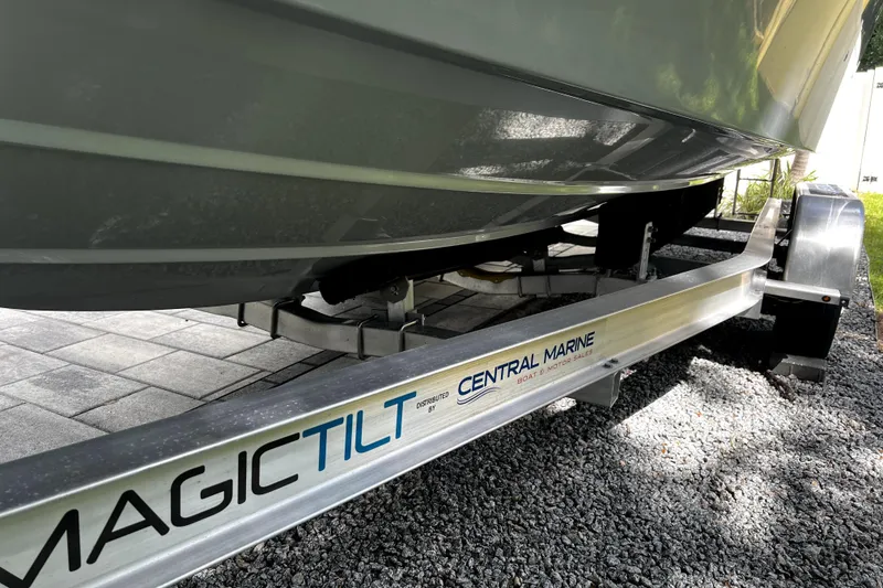 Slide: The Image of 2023 Parker 2120 Sport Cabin on Magic Tilt trailer, Central Marine branding visible. - 19