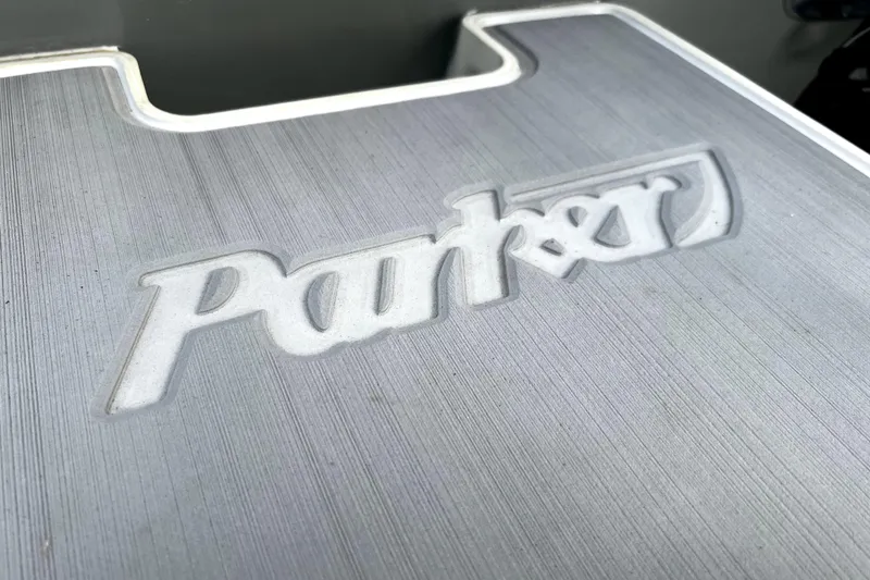 Slide: The Image of Close-up of Parker logo on 2023 Parker 2120 Sport Cabin boat surface. - 21